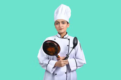Maya Torres, head baker, holding a tray of rye loaves